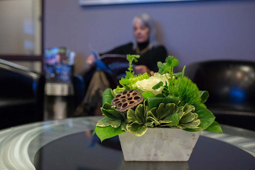 Green flower on table top