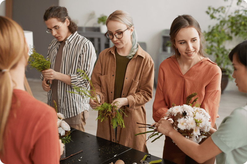 people arranging flowers